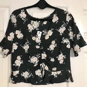 Express floral black top. NWT. Size Small